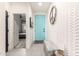 Bright entryway featuring a trendy blue door, stylish wallpaper, and a decorative peace sign wreath at 3219 W Pollack St, Phoenix, AZ 85041