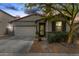 Charming single-story home features a well-manicured front yard, a two-car garage, and a welcoming entrance at 3219 W Pollack St, Phoenix, AZ 85041