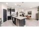 Well-equipped kitchen featuring stainless steel appliances, a central island, and an adjacent dining area at 3219 W Pollack St, Phoenix, AZ 85041