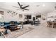 Open-concept living space featuring a modern kitchen, a cozy living area, and a stylish dining space at 3219 W Pollack St, Phoenix, AZ 85041