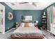Charming bedroom with a comfortable bed, stylish decor, and serene lighting for a relaxing atmosphere at 3219 W Pollack St, Phoenix, AZ 85041