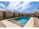 Beautiful pool with low-maintenance landscaping in the background at 3219 W Pollack St, Phoenix, AZ 85041