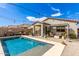 Beautiful backyard with a sparkling pool and inviting patio area at 3219 W Pollack St, Phoenix, AZ 85041