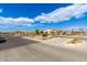 Community entrance with stone signage surrounded by landscaped features on a sunny day at 3219 W Pollack St, Phoenix, AZ 85041