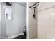 Bathroom featuring shower, toilet, and small window at 3708 S 104Th Ln, Tolleson, AZ 85353