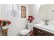 Charming powder room with decorative accents and a stylish vanity, offering a cozy and inviting space at 3708 S 104Th Ln, Tolleson, AZ 85353