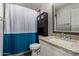 Bathroom features a vanity sink with cabinet, mirror, and toilet with storage at 3922 N 125Th Dr, Avondale, AZ 85392