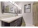 Bathroom featuring a modern vanity with granite countertop and decorative mirror at 3922 N 125Th Dr, Avondale, AZ 85392