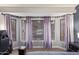 Bright bedroom features a large bay window, desk, and soft, neutral colors at 3922 N 125Th Dr, Avondale, AZ 85392
