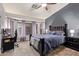 Comfortable bedroom with large windows, a ceiling fan, and plush carpeting at 3922 N 125Th Dr, Avondale, AZ 85392