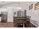 Dining area with stylish lighting and a large dining table at 3922 N 125Th Dr, Avondale, AZ 85392