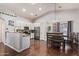 Bright dining area adjacent to the kitchen with stainless appliances and granite countertops at 3922 N 125Th Dr, Avondale, AZ 85392