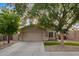 Inviting home exterior with manicured lawn, desert landscaping, and a two-car garage at 3922 N 125Th Dr, Avondale, AZ 85392