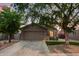 Well-maintained single-Gathering home with desert landscaping, artificial turf, and mature trees at 3922 N 125Th Dr, Avondale, AZ 85392