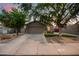 Charming single-story home with a well-manicured lawn and a two-car garage at 3922 N 125Th Dr, Avondale, AZ 85392