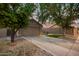 Charming home with desert landscaping, green turf, and a spacious driveway at 3922 N 125Th Dr, Avondale, AZ 85392