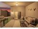 Covered outdoor patio with grill and furniture at 3922 N 125Th Dr, Avondale, AZ 85392