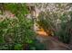 Well-maintained side yard with lush greenery and mature trees at 3922 N 125Th Dr, Avondale, AZ 85392