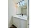 Bathroom featuring modern vanity, large mirror, and modern light fixture at 42418 W Sunland Dr, Maricopa, AZ 85138