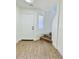 Welcoming entryway with modern flooring, a front door, and staircase at 42418 W Sunland Dr, Maricopa, AZ 85138