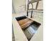 Modern kitchen sink with a custom cutting board and a stylish faucet, making meal prep a breeze at 42418 W Sunland Dr, Maricopa, AZ 85138