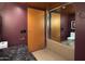 A powder room with dark walls, sink, and mirror at 4808 N 24Th St # 1424, Phoenix, AZ 85016