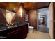 Contemporary bathroom featuring granite counters, dark wood cabinetry, and elegant decor at 4808 N 24Th St # 1424, Phoenix, AZ 85016
