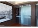 Modern closet with frosted glass doors and an eye-catching Venice art piece at 4808 N 24Th St # 1424, Phoenix, AZ 85016