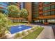 Beautiful building courtyard featuring a blue fountain and walkway with views of the building at 4808 N 24Th St # 1424, Phoenix, AZ 85016