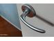 Close-up view of a modern, brushed-silver door handle at 4808 N 24Th St # 1424, Phoenix, AZ 85016