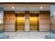Two modern elevators with metal doors provide easy access to all floors of the residence at 4808 N 24Th St # 1424, Phoenix, AZ 85016