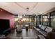 Open living room with walls of windows providing city views, modern furniture, and elegant decor at 4808 N 24Th St # 1424, Phoenix, AZ 85016