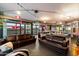 Spacious living room with leather sofas, modern lighting, and expansive views at 4808 N 24Th St # 1424, Phoenix, AZ 85016
