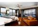 Serene main bedroom with hardwood floors, city views, a sleek ceiling fan, and modern furnishings at 4808 N 24Th St # 1424, Phoenix, AZ 85016