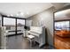 Well-lit office space with large windows and city views includes a piano, desk, and modern decor at 4808 N 24Th St # 1424, Phoenix, AZ 85016