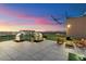 Upscale rooftop deck with grilling stations, lounge seating, and panoramic city views at sunset at 4808 N 24Th St # 1424, Phoenix, AZ 85016