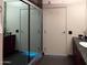 Glass shower door and view to a clean and modern bathroom at 4808 N 24Th St # 1424, Phoenix, AZ 85016