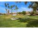 A well-maintained community lawn with picnic tables, shade trees, and townhomes at 4901 S Calle Los Cerros Dr # 219, Tempe, AZ 85282