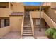 Exterior of a unit with access stairs and desert landscaping at 4901 S Calle Los Cerros Dr # 219, Tempe, AZ 85282