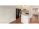 Functional kitchen with black appliances and white cabinets at 4901 S Calle Los Cerros Dr # 219, Tempe, AZ 85282