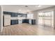 Spacious kitchen features abundant cabinetry, modern appliances, and sliding glass door with backyard access at 508 W Pampa Ave, Mesa, AZ 85210