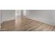 Open-concept living room with laminate flooring and natural light, offering a bright and airy space at 508 W Pampa Ave, Mesa, AZ 85210