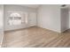 Bright living room features laminate flooring and neutral walls, creating a welcoming and modern space at 508 W Pampa Ave, Mesa, AZ 85210