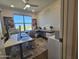 Well-lit home office with large windows, clean desk, and a modern chair create a productive workspace at 5100 E Rancho Paloma Dr # 1044, Cave Creek, AZ 85331