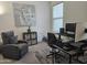 Comfortable home office with gray chair, desk, and carpet featuring natural light from a nearby window at 5100 E Rancho Paloma Dr # 1044, Cave Creek, AZ 85331