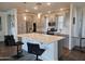 Modern kitchen with stainless steel appliances, sleek countertops, and island with bar seating at 5100 E Rancho Paloma Dr # 1044, Cave Creek, AZ 85331