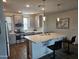 The modern kitchen is filled with stainless appliances, sleek grey cabinetry, and quartz countertops at 5100 E Rancho Paloma Dr # 1044, Cave Creek, AZ 85331