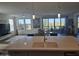 Bright open-concept living space featuring large windows, modern fixtures, and access to outdoor balcony at 5100 E Rancho Paloma Dr # 1044, Cave Creek, AZ 85331