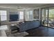 Spacious and bright living room featuring wood floors, neutral decor, and balcony access at 5100 E Rancho Paloma Dr # 1044, Cave Creek, AZ 85331