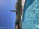 Inviting pool with clear blue water, surrounded by lush greenery and desert landscaping at 5100 E Rancho Paloma Dr # 1044, Cave Creek, AZ 85331